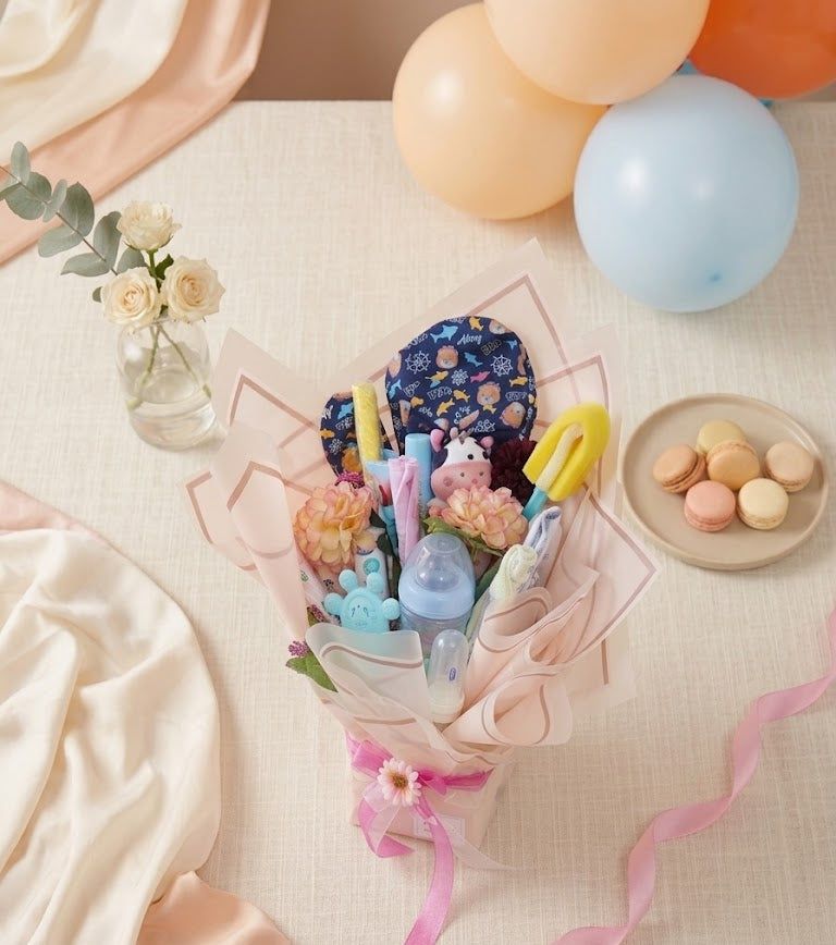 Bouquet of toys and flowers with balloons on a light surface