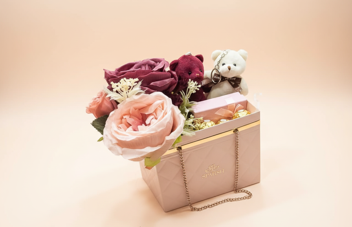 A gift hamper with  scented flowers, teddy bears, a superise gift and chocolates for valentine