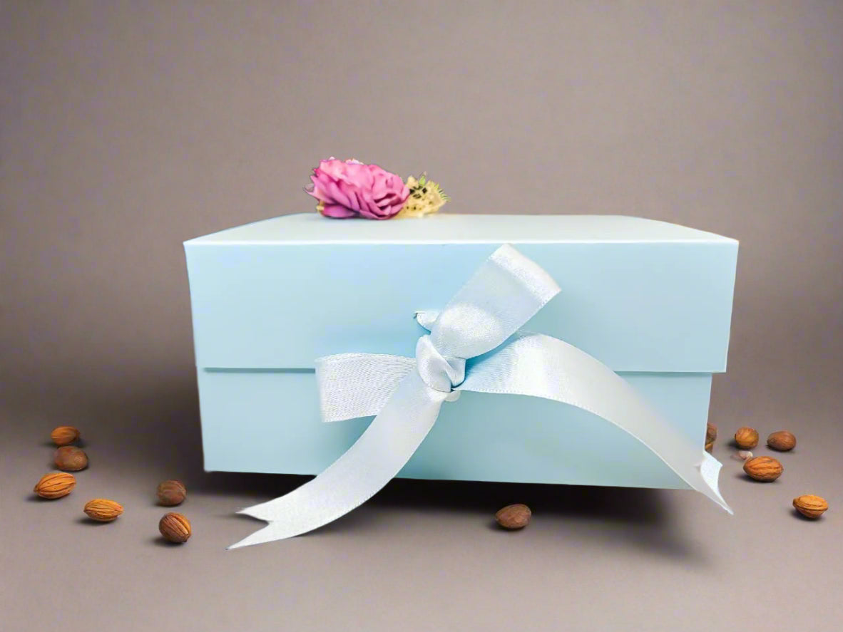 Buy Powder Blue Cardboard Gift Box with Dry Fruits, Chocolates & Glass Sipper – Luxury Hamper by SPARSH