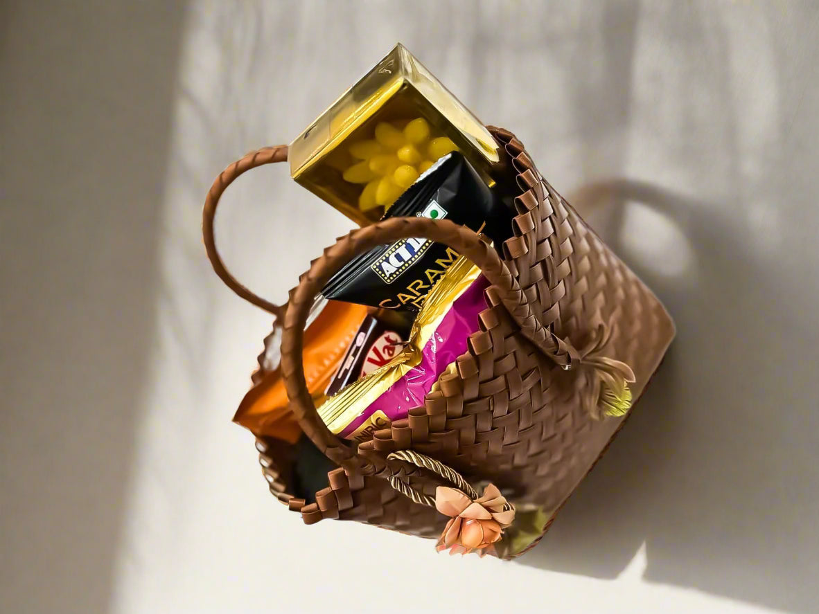 Buy Brown Cane Bag with Floral Candles & Snacks – Luxury Festive Gift Hamper by SPARSH