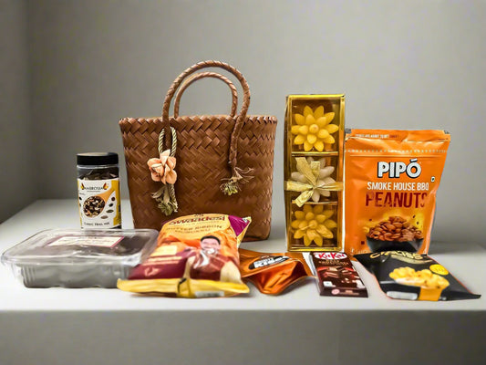 Buy Brown Cane Bag with Floral Candles & Snacks – Luxury Festive Gift Hamper by SPARSH