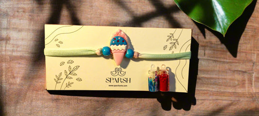 Baby Rakhi – Soft Handmade Rakhi for Babies with Roli and Rice Bottles