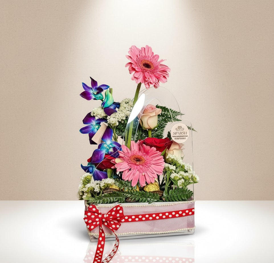 Floral arrangement in a box with a red polka dot ribbon on a beige background